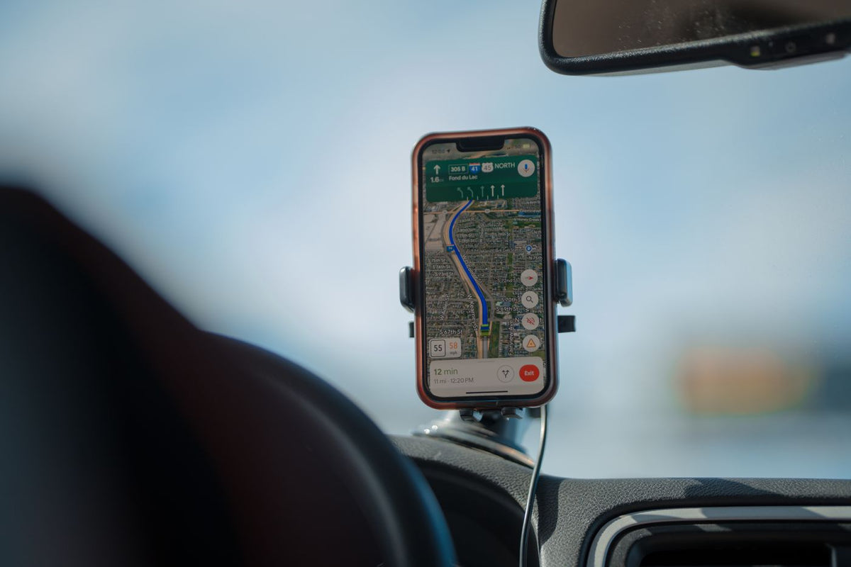 Bluetooth FM transmitter adapter plugged into a car 12V socket