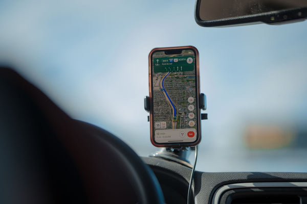 Bluetooth FM transmitter adapter plugged into a car 12V socket