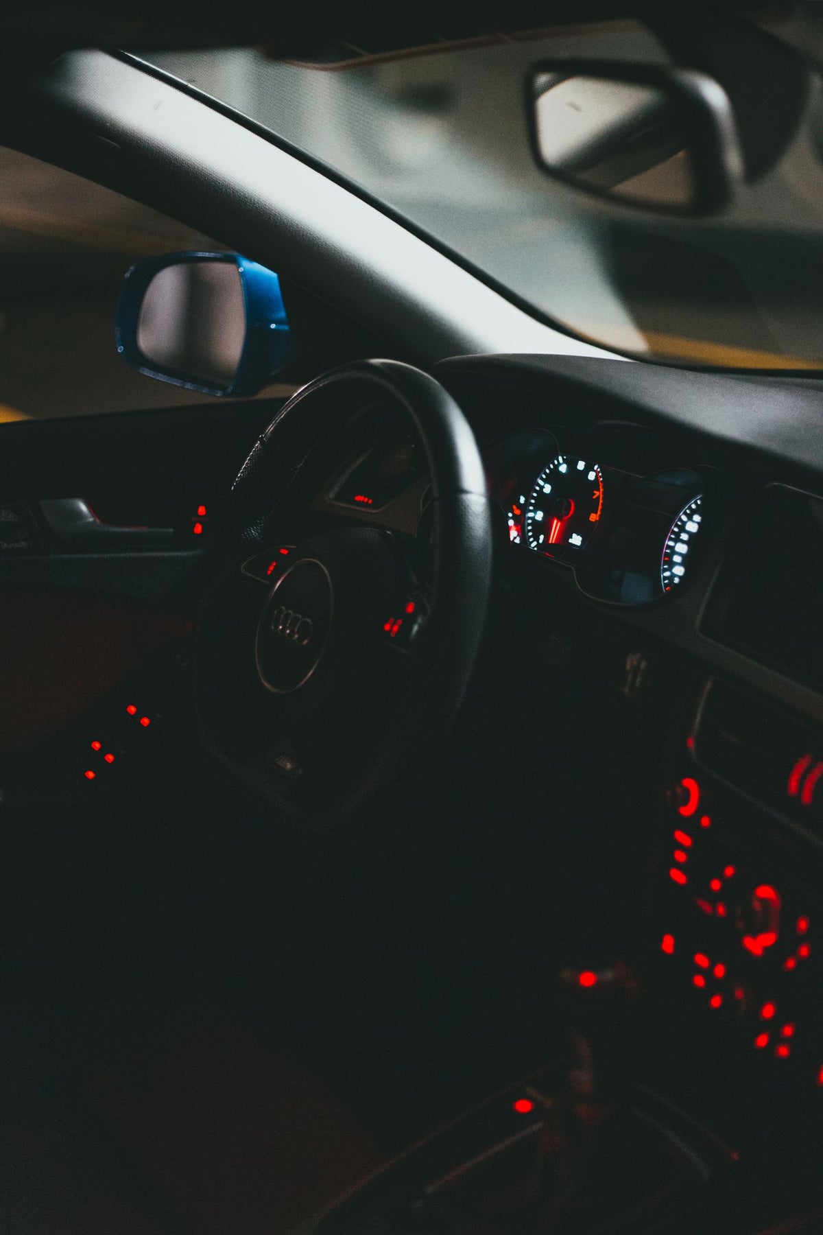 Car interior lit with colored RGB ambient LED lighting at night